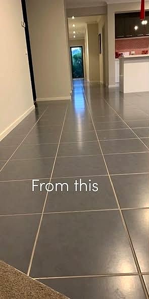 Before: dated grey tile through the hallway
